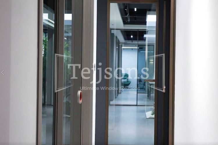 Tejsons motorized glass doors in a modern office interior