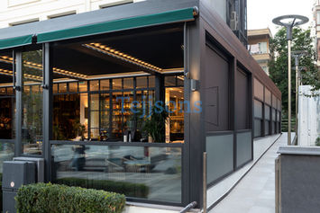 Modern guillotine glass enclosure and outdoor awning
