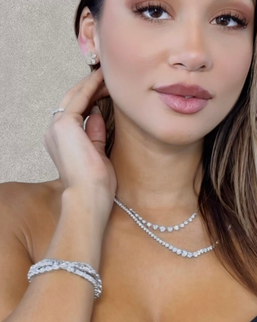Trade show models in Miami showcasing lab-grown diamond jewelry for Guru Diam at JIS Fall Show 2024.