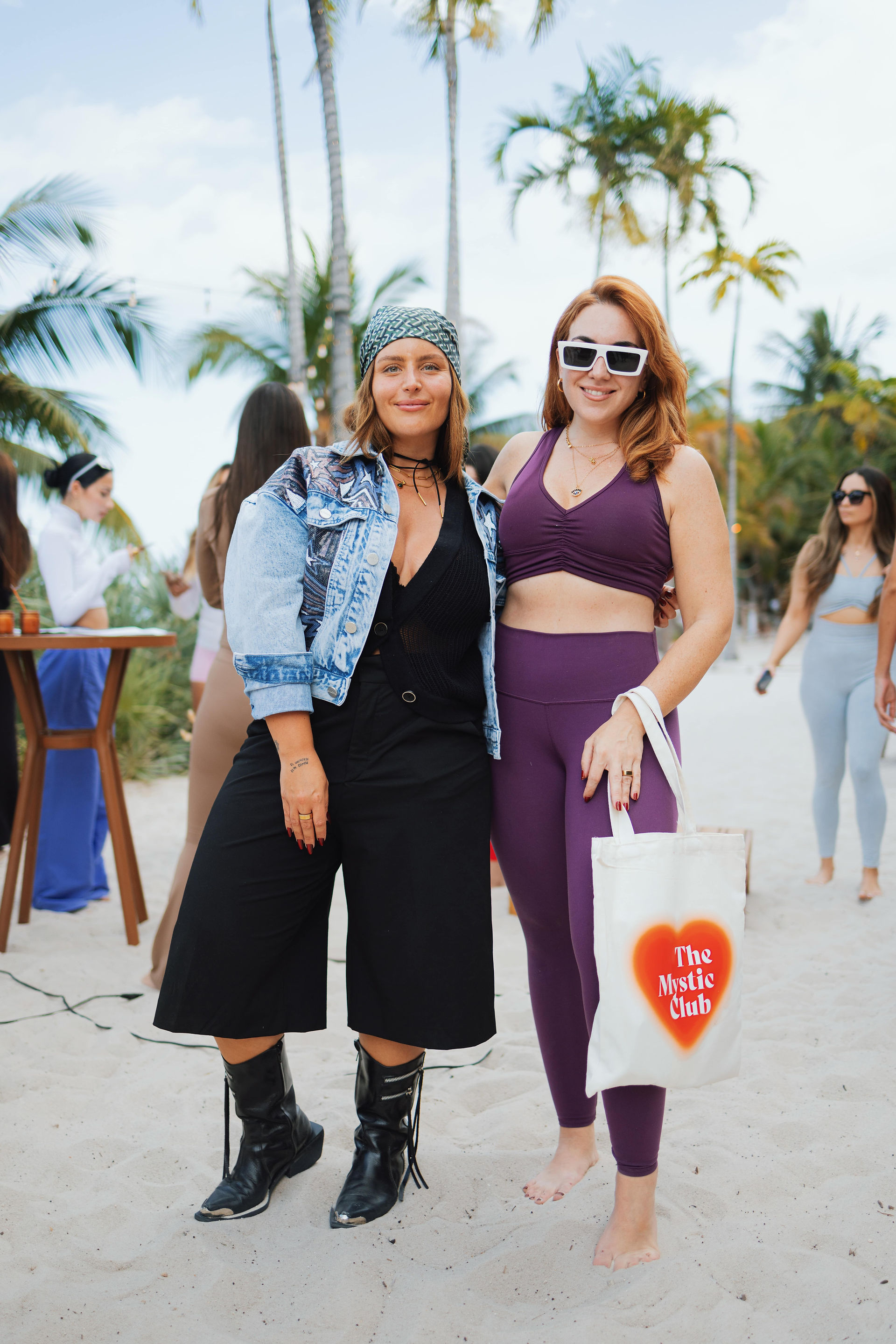 Guests at The Real Love Event Miami engaging in a yoga session led by Jihan, embracing movement and 