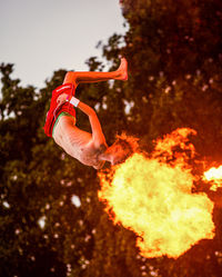 Sports marketing campaign still featuring an athlete mid-dive captured for social media and digital content distribution.