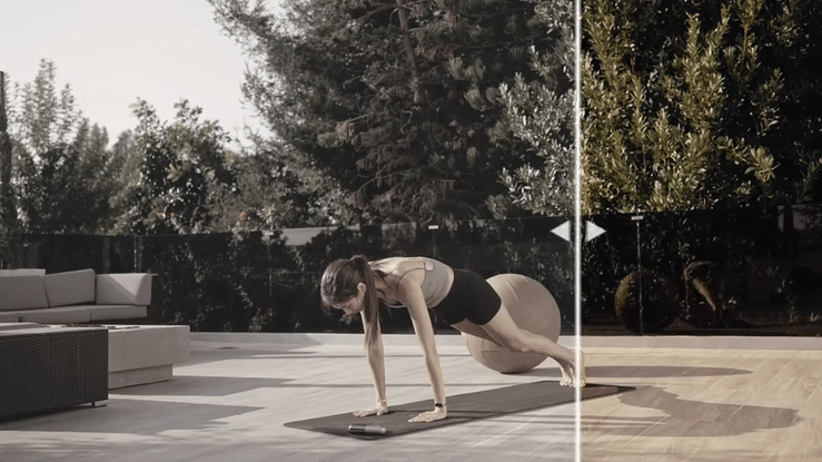 Motion graphic of a slider demonstrating before and after color grading on a video of a woman doing yoga.