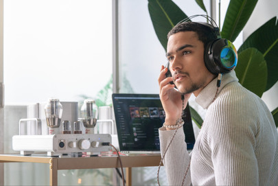 a man wearing headphones is listening to music on spotify