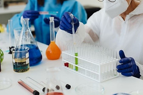 Scientists with beakers