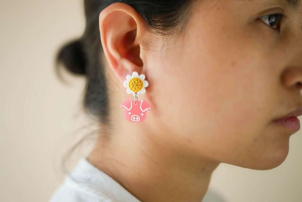Thumbnail: Handcrafted pig and daisy earrings by Deaney Weaney Blooms with pink acrylic pigs and yellow quilled daisy centers