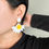Thumbnail: Horizontal Half a daisy earrings