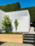 planter box with trees and new plants