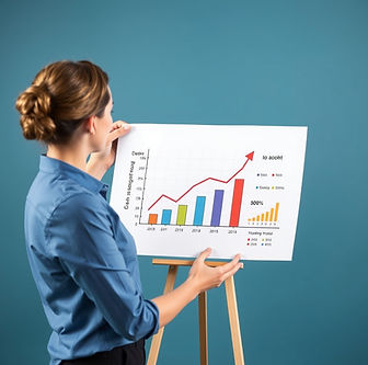 woman in blue shirt presenting a flipchart with graph of increasing sales
