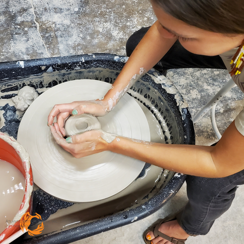 centering clay on wheel