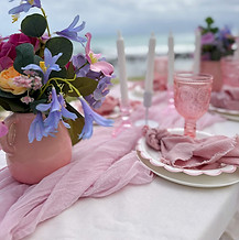 DIY Spring Garden picnic hire with pink florals and luxury table styling.