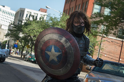 The Winter Soldier holding cap shield