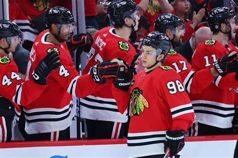 In this picture, Connor Bedard is celebrating a goal in Chicago's United Center.