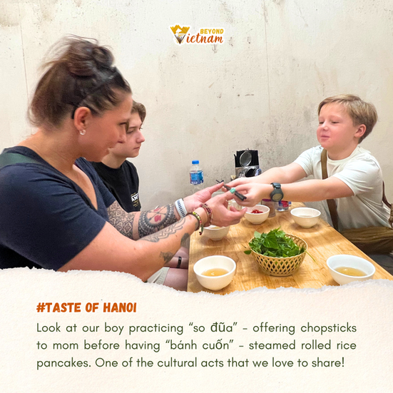 Look at our boy practicing “so đũa” - offering chopsticks to mom before having “bánh cuốn” - steamed