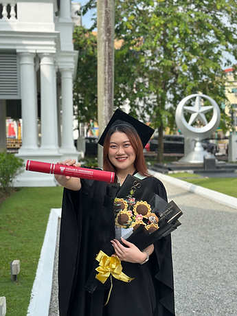 Denise Chang in her graduate robe