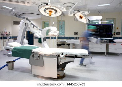 female-physiotherapist-doctor-standing-by-stretcher-writing-down-data-her-patient.jpg