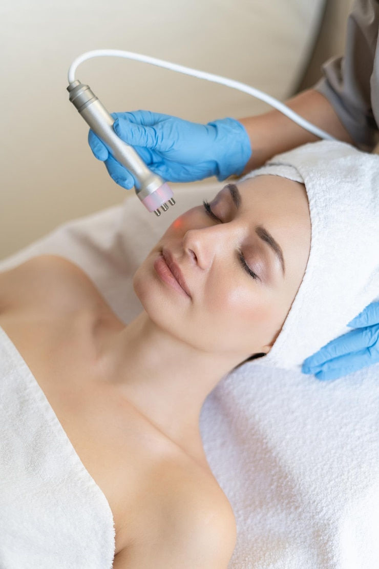 young-woman-lying-cosmetologist-s-table-rejuvenation-procedure-cosmetologist-take-care-abo