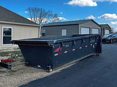 A 16-yard roll-off construction dumpster in Lebanon, TN, featuring a compact design that fits easily in driveways .