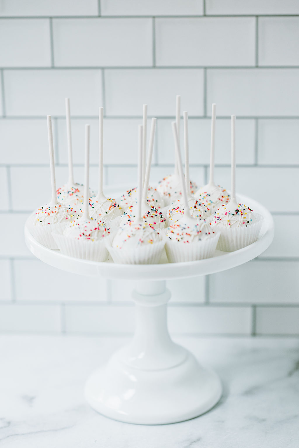 Gluten free vanilla cake pops with rainbow sprinkles from Seatown Sweets
