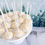 Thumbnail: Champagne cake pop on a platter and a wintery background