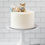 Thumbnail: Baby shower cake with a blue teddy bear and blue balloon design