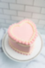 Thumbnail: Vintage Custom Heart Shaped Cake in White and Pink