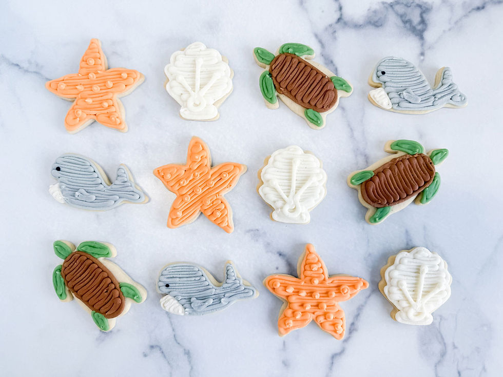 Under the Sea themed sugar cookies featuring starfish, seashell, turtle, and whale designs.