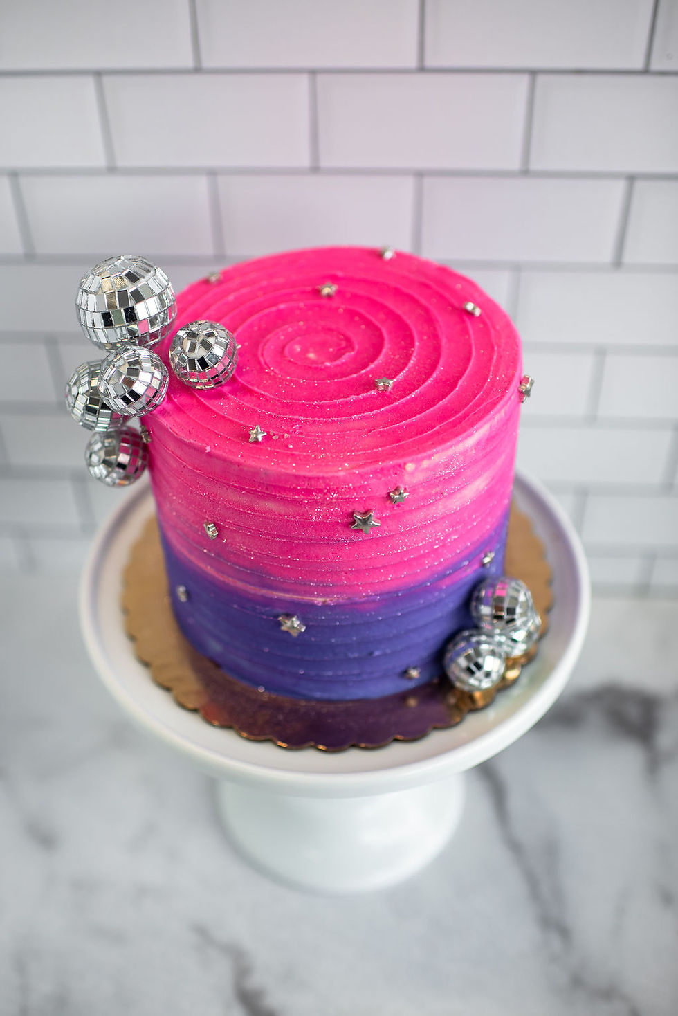 Pop Star Themed cake with pink and purple buttercream and silver disco ball accents