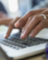 Man Typing on a Laptop
