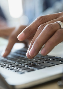 Typing on laptop