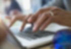 Man Typing on a Laptop