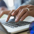Typing on laptop