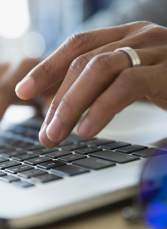 Typing on laptop