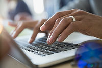 Typing on laptop