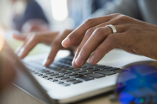 Typing on laptop