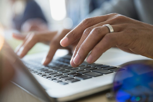 Typing on laptop