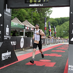Connor Graham Real Estate Agent Crossing Finish Line at race