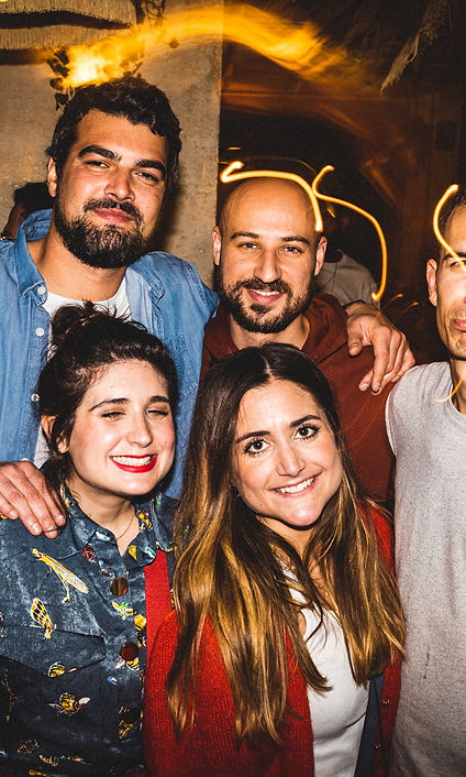 A group of people celebrating with cocktails at Musa Paris' festive cocktail bar