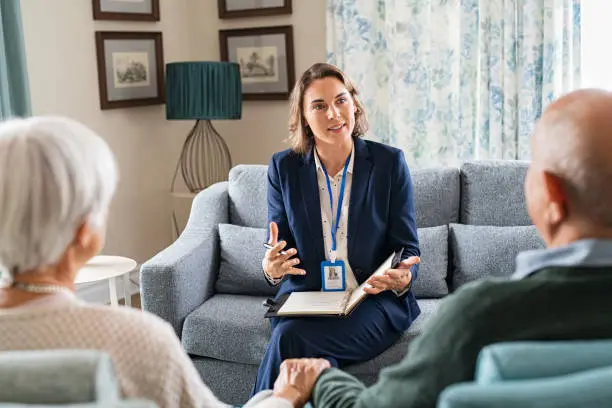 Senior living advisor reviewing care options with an older couple
