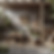 an outdoor bar designed in a Wabi-Sabi minimalist rustic style, with no people present. The color palette features soft grays, muted greens, and warm browns, reflecting the natural elements of stone