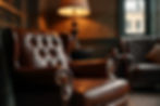 Eye-level view of a leather armchair in a cozy gentlemen's lounge