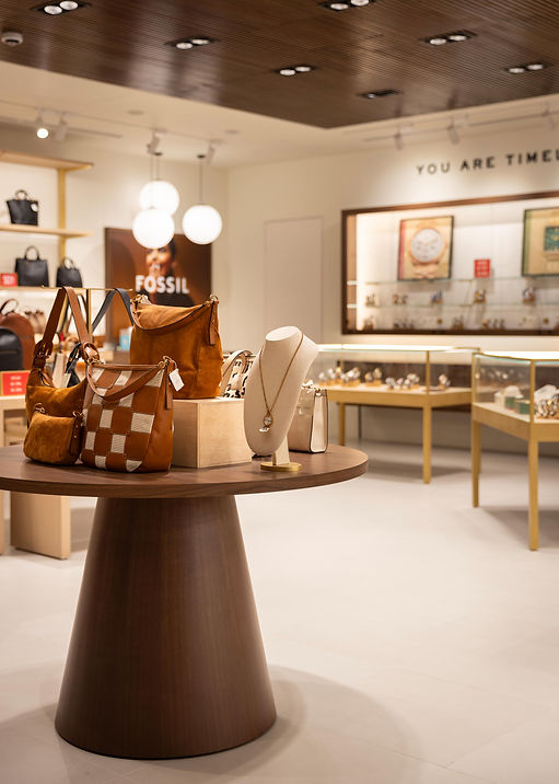 Feature display table in the Fossil retail interior.