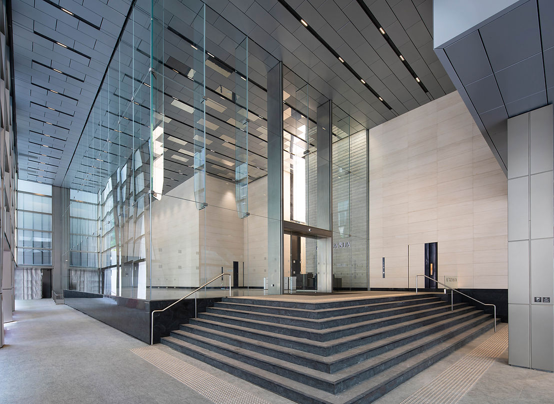 Lobby interior view of a commercial office tower in Singapore.