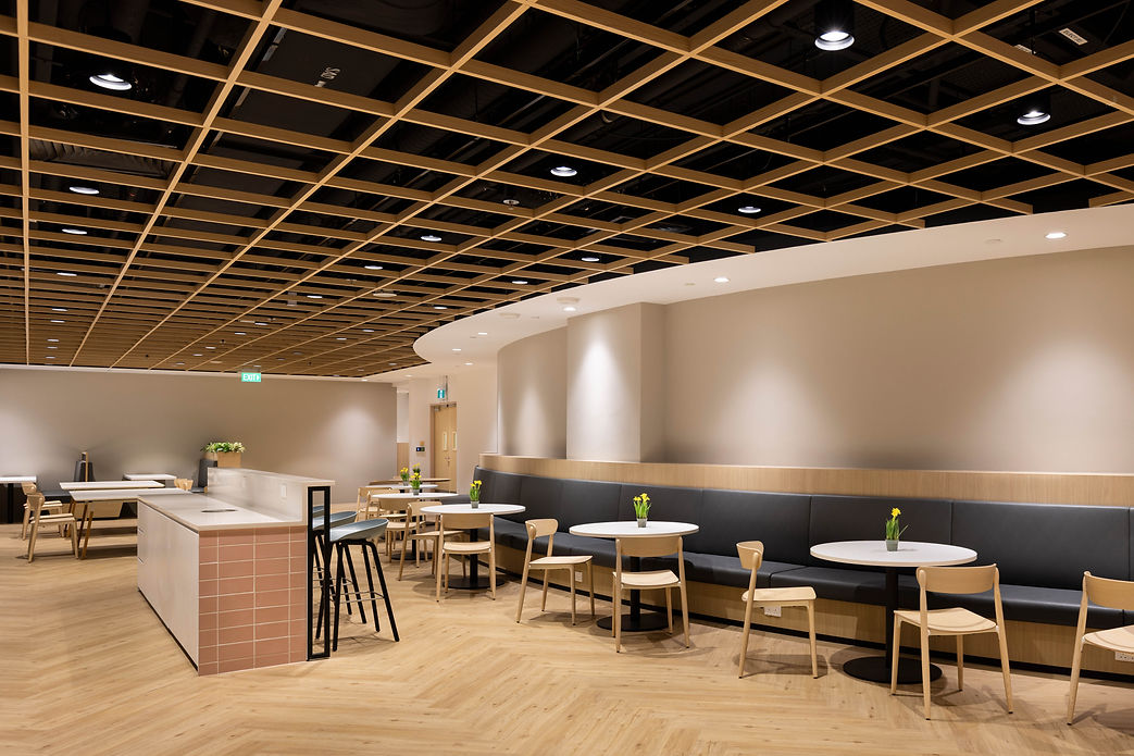 Pantry and breakout area in the Singtel workplace interior.