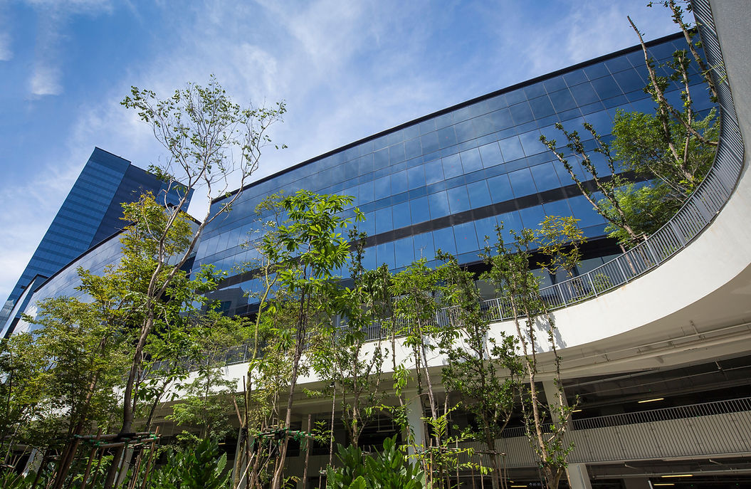 Curved façade view of an integrated business campus in Singapore.