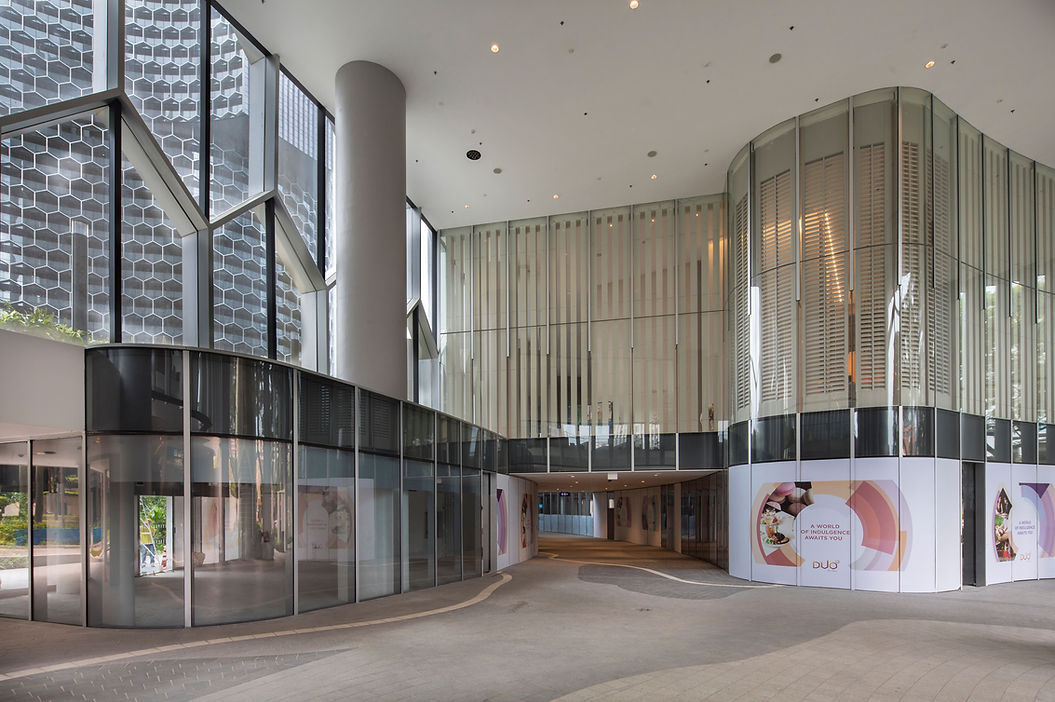 Retail frontage view of an integrated mixed-use development in Singapore.