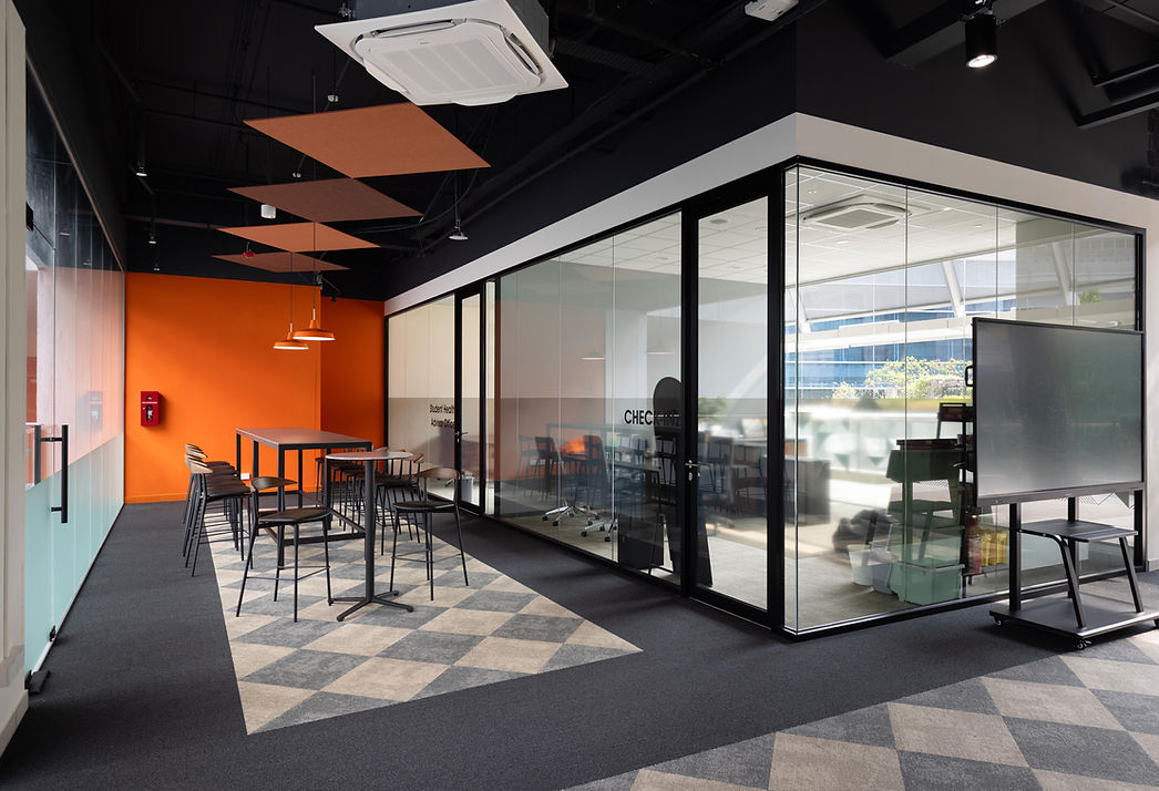 Glass meeting room in the ITE College interior.