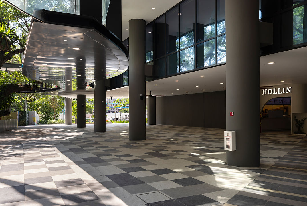 Retail frontage view of an integrated residential and retail development in Singapore.