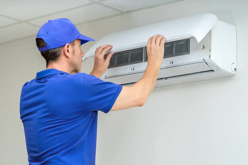 a technician checking a wall mounted unit for London A/C repair