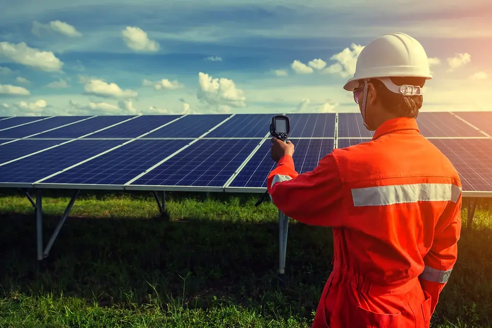a technician in front of a solar panel array for solar panel servicing London