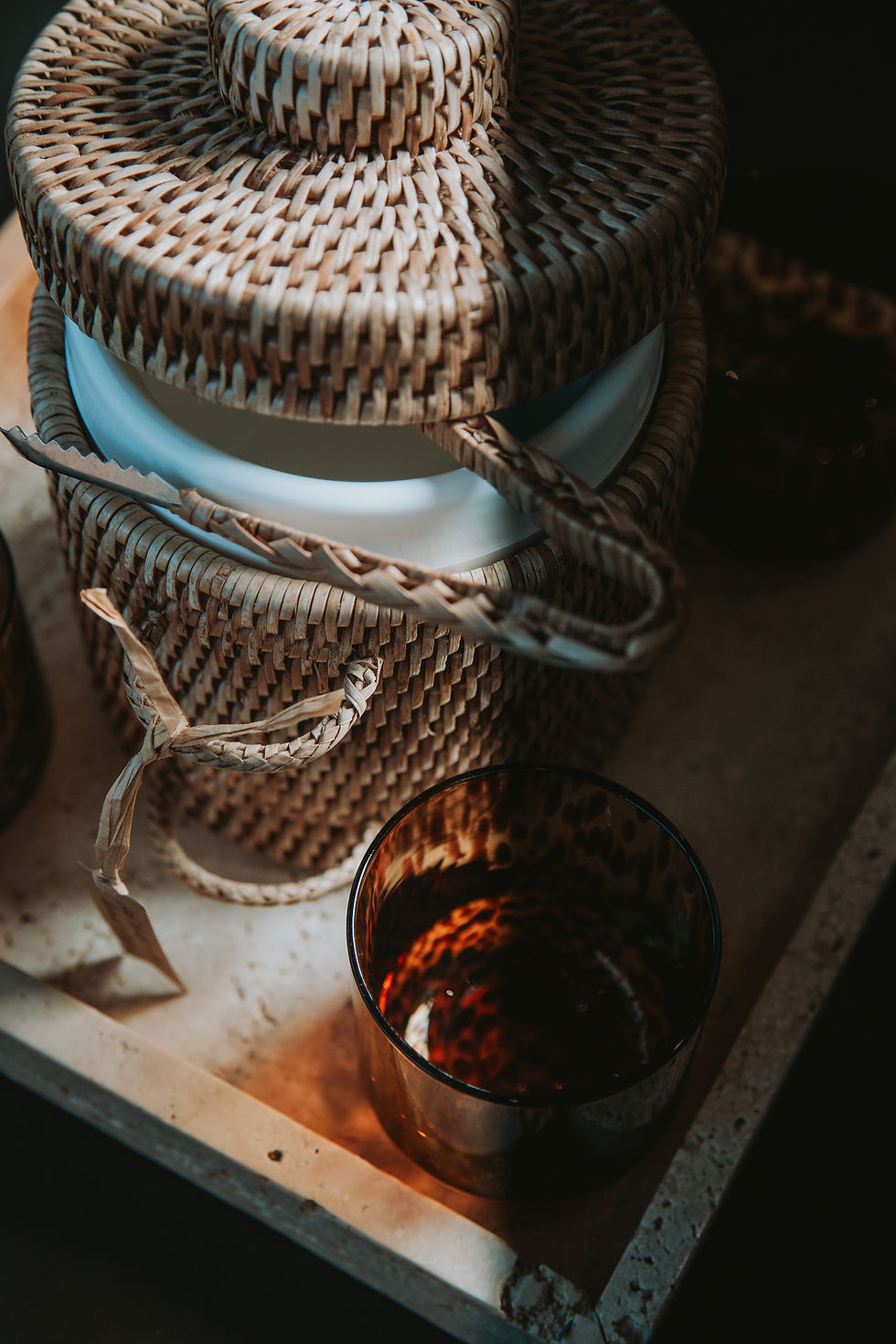 Thick woven rattan ice bucket with tongs, combining natural style and functionality for entertaining and keeping drinks cool